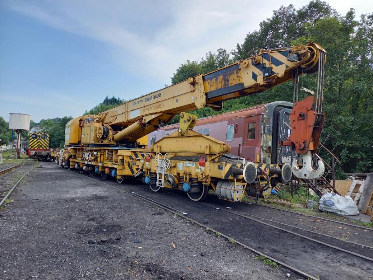 a train is parked on the side of the road