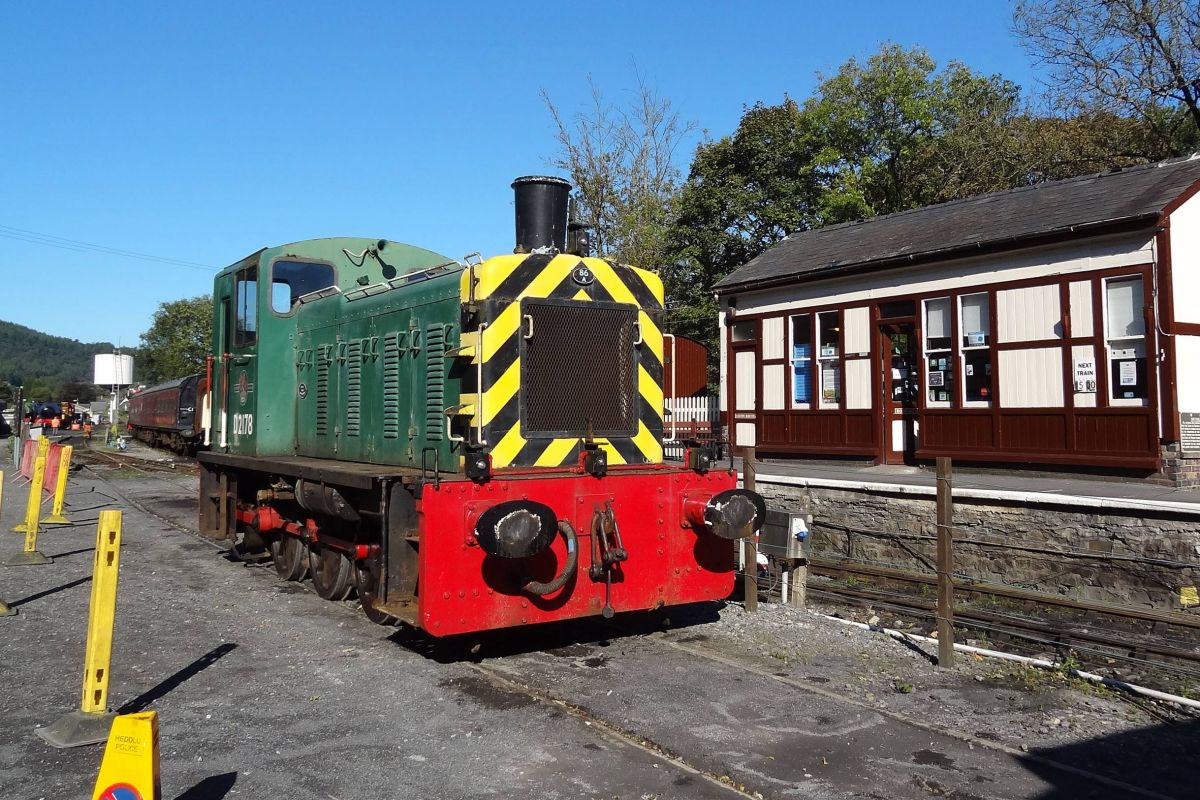 a train engine carrying carts down a track