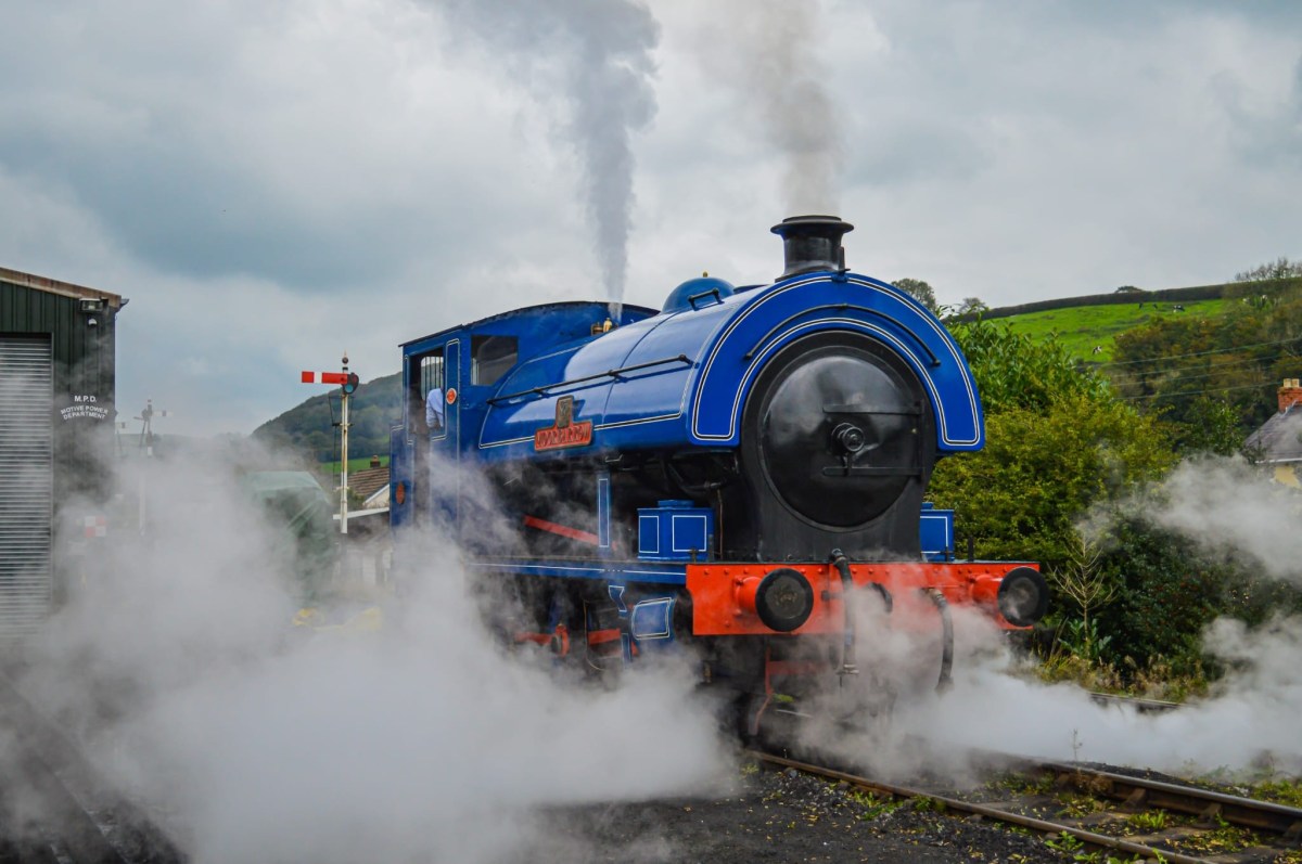 Dining Trains Image 4 a fire engine on a train track with smoke coming out of it