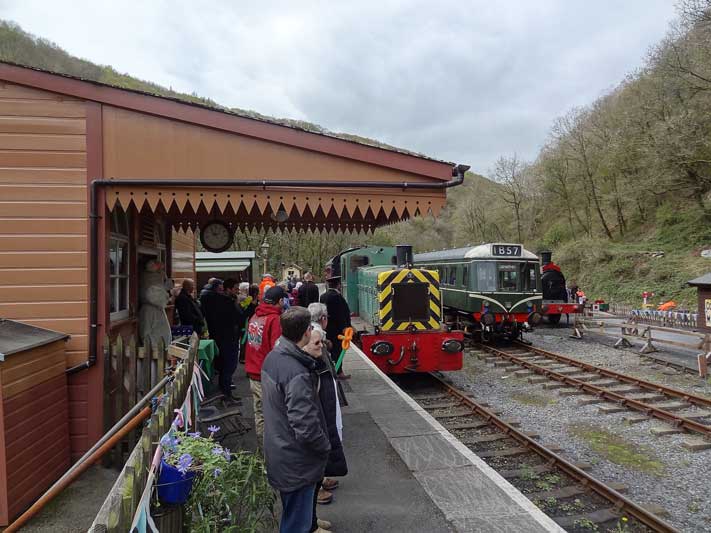 a group of people standing in a train station