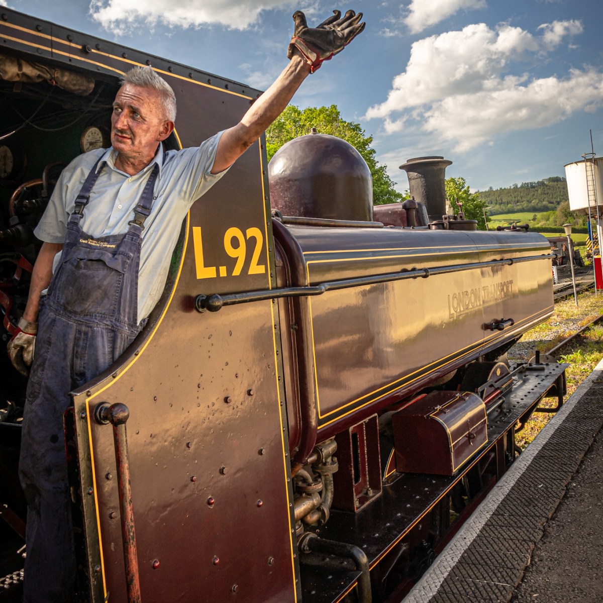 a man standing next to a train