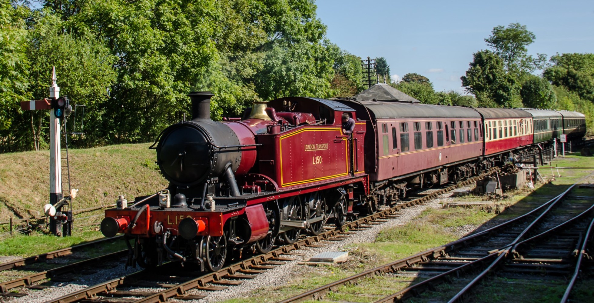 a train engine carrying carts down a track