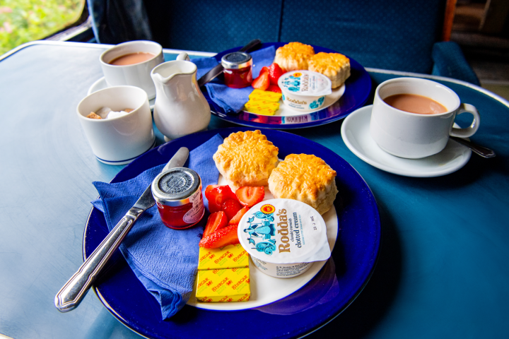 a plate of food and a cup of coffee