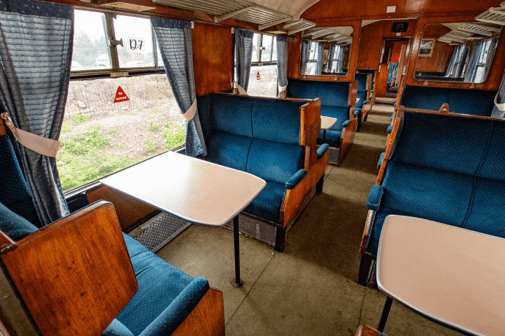 a room filled with furniture and a blue chair