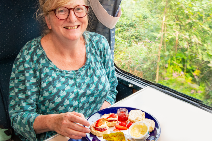 a woman holding a plate of food